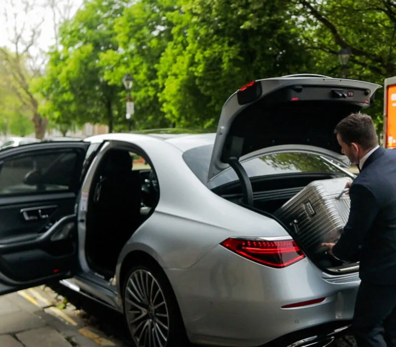Driver loading airport car